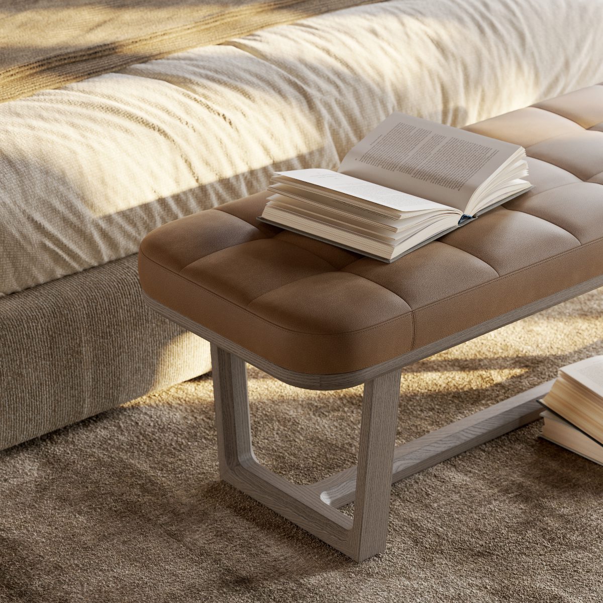 vincent bench in leather A stylish brown leather bench positioned on a bed, creating a chic and inviting atmosphere in the space.