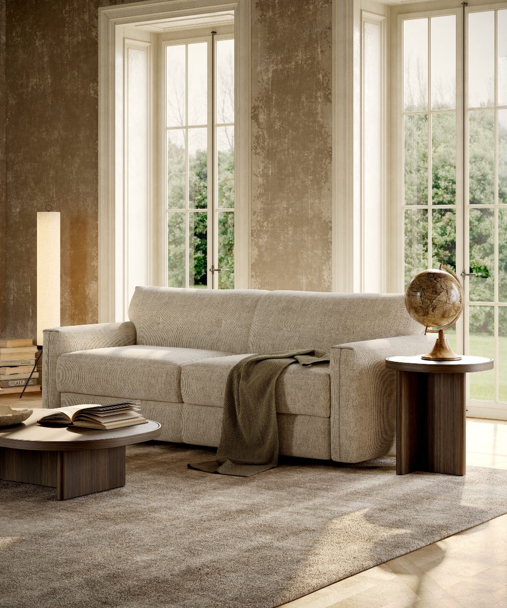 jacques sofa bed design A welcoming living room with a comfortable sofa bed, a coffee table, and a large window for sunlight.