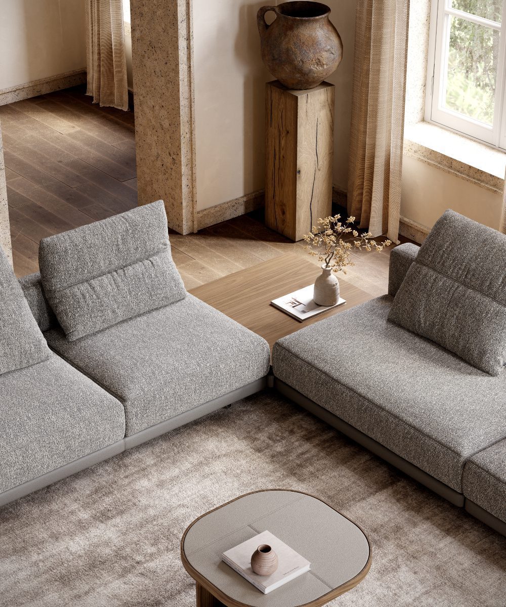 laurent modular sofa and gilbert table set living room A bright living room showcasing a modular sofa and a coffee table, creating a welcoming atmosphere.