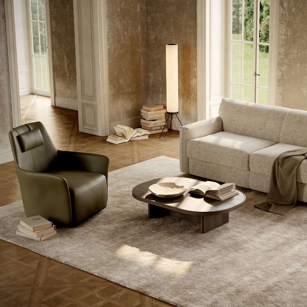 living room set with alexander A cosy living room featuring a sofa bed, armchair, coffee table, lamp, and a decorative rug.