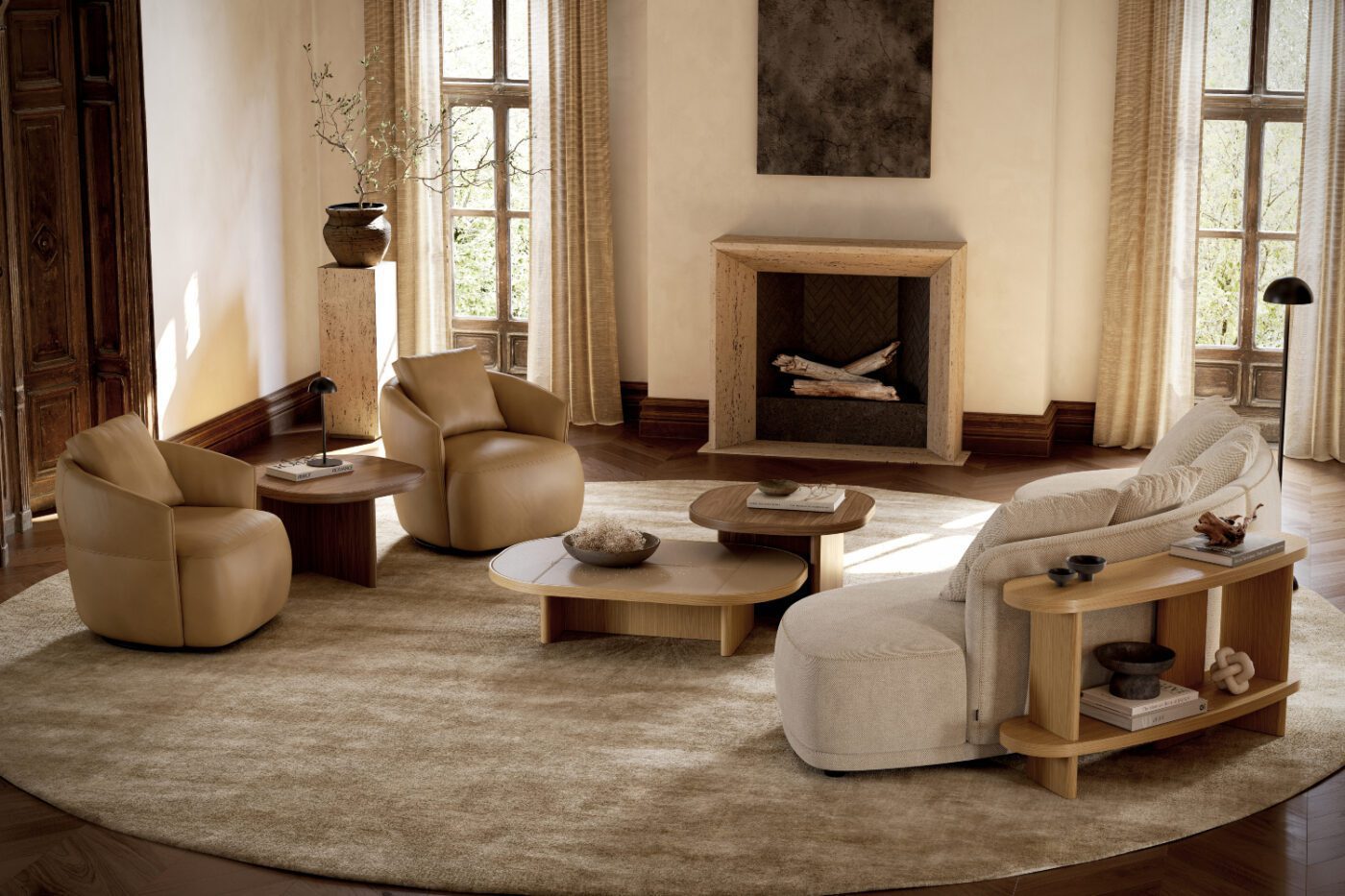 living room set with olivia sofa, console and gilbert~ A cosy living room featuring a fireplace and a round rug, creating a warm and inviting atmosphere. With two armchairs in brown leather, a curver sofa, a curved console and a table set with three tables. Room by room.