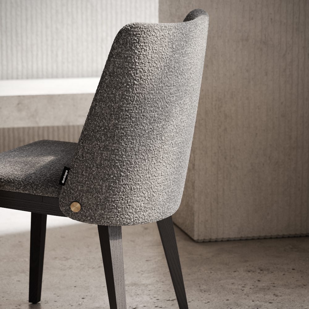A chair showcasing a grey upholstered seat, blending functionality and aesthetic appeal in home or office environments.