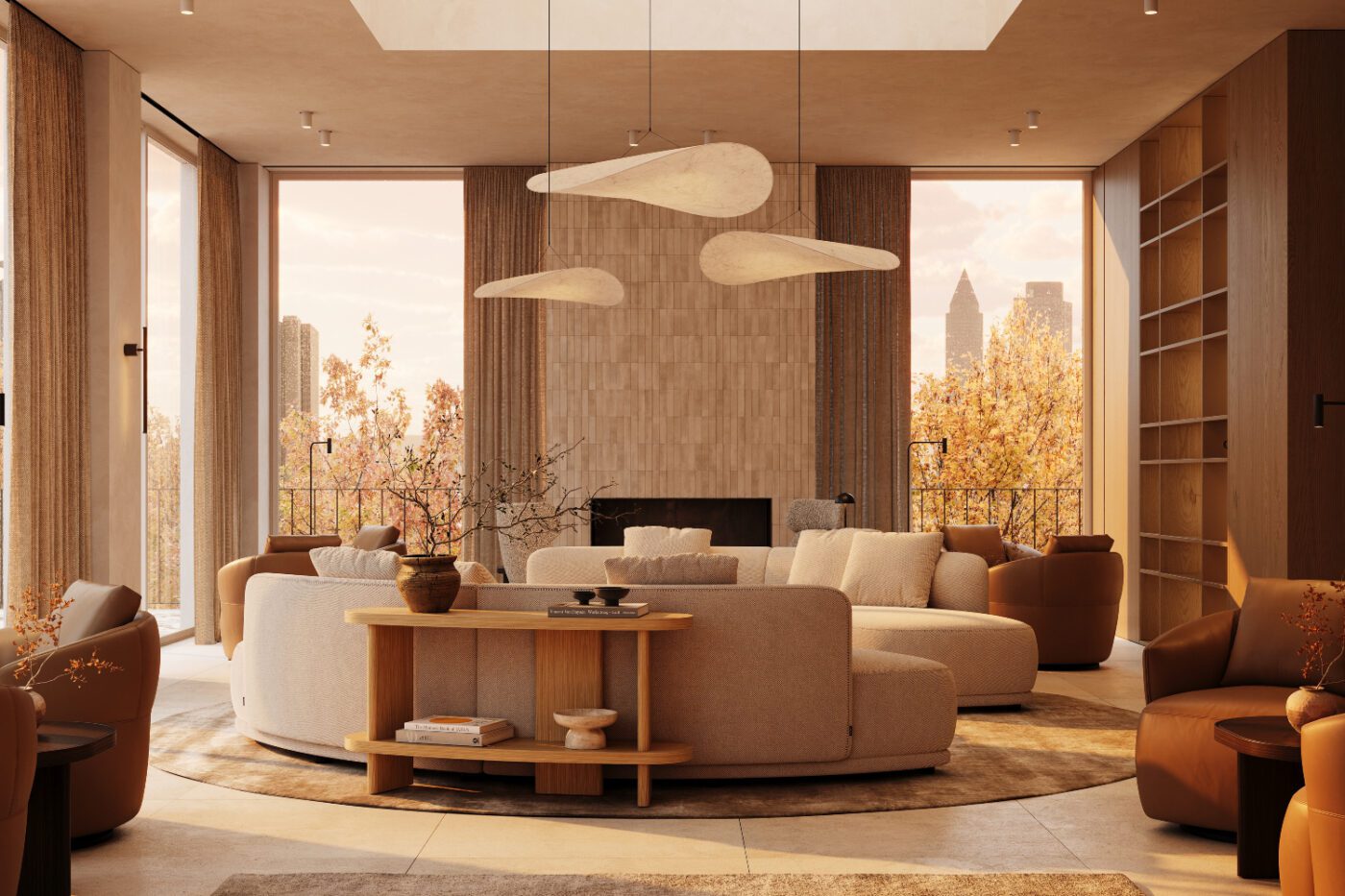 A cosy living room with a large circular modular sofa, a console and several armchairs arranged for conversation. Autumn trends