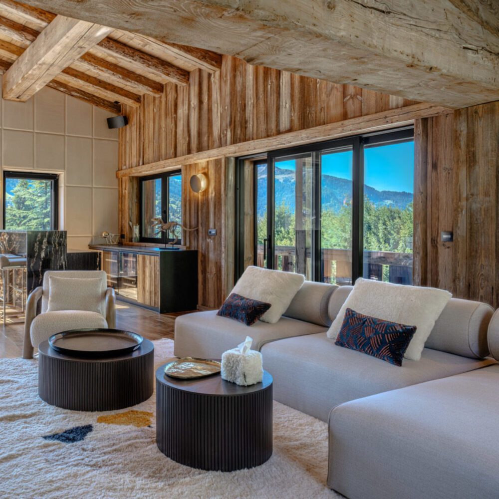 shinto sofa in aloona design project infinity A charming living room adorned with wooden walls and a modular sofa, enhancing the room's warmth and character. By Aloona Design